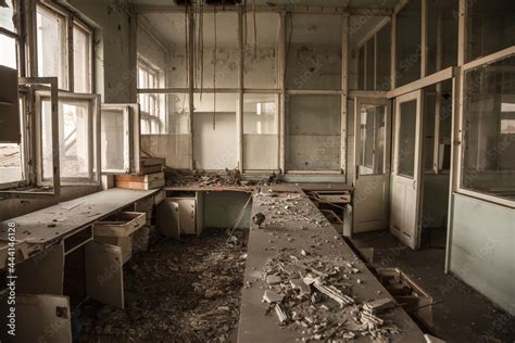 Interior of an abandoned office building, in a dirty and damaged room ...