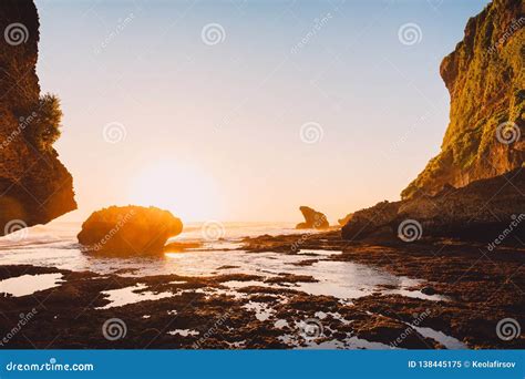 Rocky Cliff with Ocean at Warm Sunset in Bali. Low Tide in Ocean Stock ...