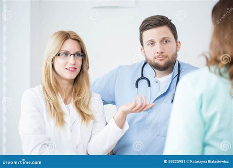 Doctors in a hospital stock image. Image of hair, scrubs - 55325951