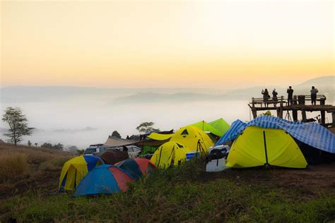 Camping tent area on mountain, tourist tent camping with fog mist ...