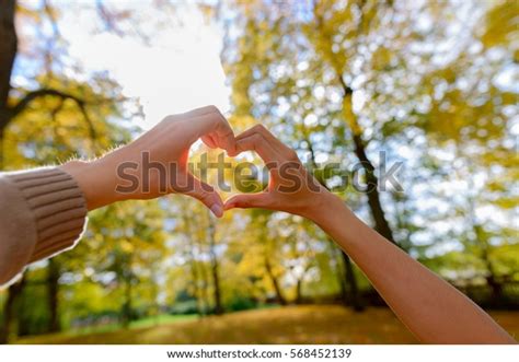 Couple Making Hand Heart Sign Together Stock Photo (Edit Now) 568452139