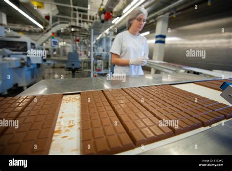 A worker at the Swiss chocolate factory of Lindt & Spruengli in Zurich ...