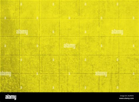 Dirty yellow wall with tiles Stock Photo - Alamy