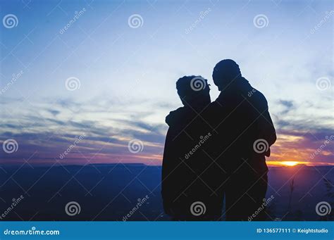 Silhouette Romantic Couple Lovers Hug and Kiss at Colorful Sunset Stock ...