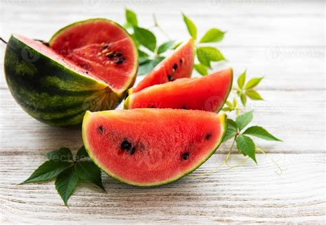 Watermelon with green leaves 4898639 Stock Photo at Vecteezy