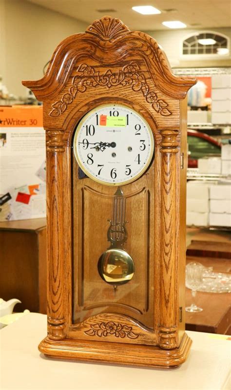 SOLID OAK HOWARD MILLER PENDULUM WALL CLOCK.