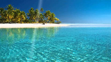 Download Tropical Beach Island Clear Waters Wallpaper | Wallpapers.com