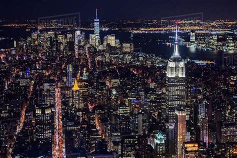 an aerial view of new york city at night from the top of the empire ...