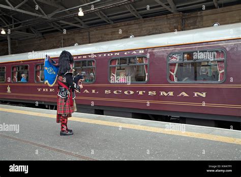 A piper greeting The Royal Scotsman train in Edinburgh Waverley train ...