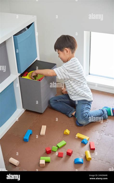 Children Cleaning Up Toys