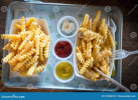 Ridged French Fries with Three Different Condiments Stock Photo - Image ...