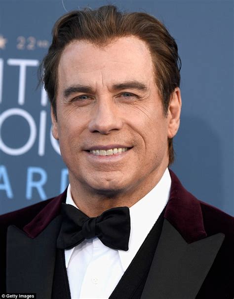 John Travolta showcases his latest hairpiece at the 22nd annual Critics ...