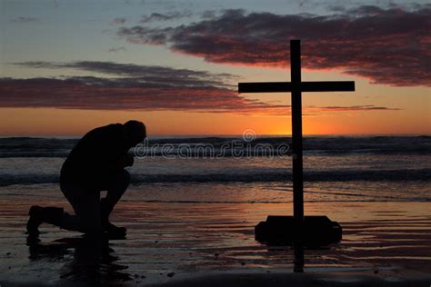 Man Kneeling Cross stock image. Image of water, conceptual - 33357239