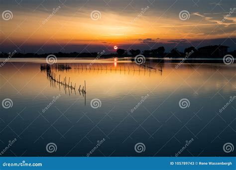 Sunset at a lake in Italy stock image. Image of lake - 105789743