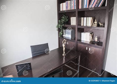 Modern Home Office with Bookshelves and Sculptures. Stock Image - Image ...