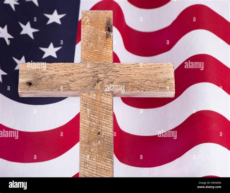 Memorial Day wooden cross over an American flag Stock Photo - Alamy