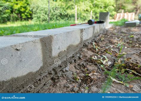 Bricklaying the Wall and Tools for this Stock Photo - Image of obsolete, stonework: 195995224