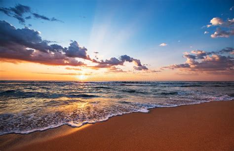 Beach Sunrise Over the Tropical Sea. Colorful Sunset with Wave Splashes ...