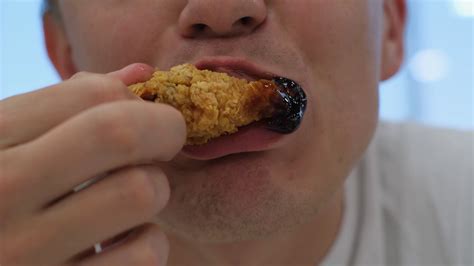 Young Man Eating Chicken Nuggets In Fast Stock Footage SBV-347773019 ...