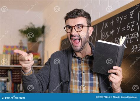 Angry Teacher Pointing with Finger in Classroom Stock Photo - Image of ...