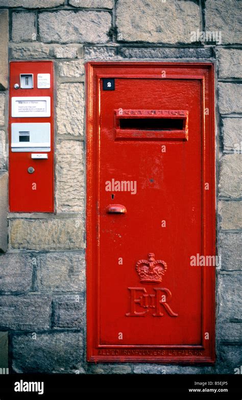 Queen Elizabeth II Post Office letter box with accompanying 50p stamp ...