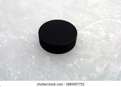 Hockey Puck On Ice Stock Photo 98857241 | Shutterstock