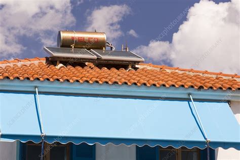 Solar panels on houses - Stock Image - C024/2137 - Science Photo Library