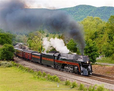 Norfolk & Western Class J 611 steam locomotive passing underneath the ...