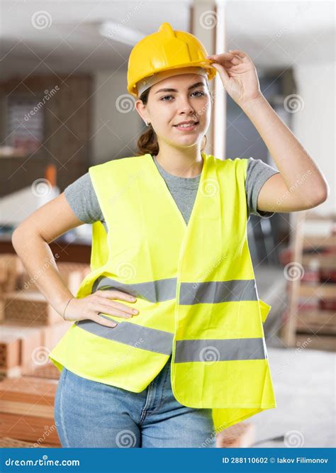 Smiling Female Civil Engineer in Yellow Uniform at Construction Site ...