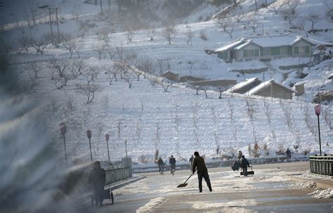 North Koreans forced to clear snow from roads to capital on Lunar New ...