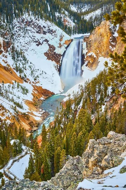 Premium Photo | Amazing upper falls in winter at yellowstone