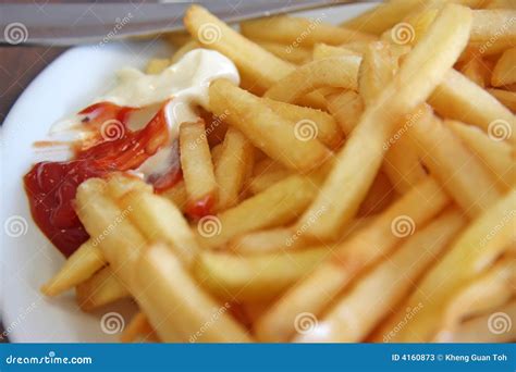 French Fries with Condiments Stock Image - Image of pile, meal: 4160873