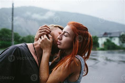 beautiful couple hugging in the rain 11369655 Stock Photo at Vecteezy