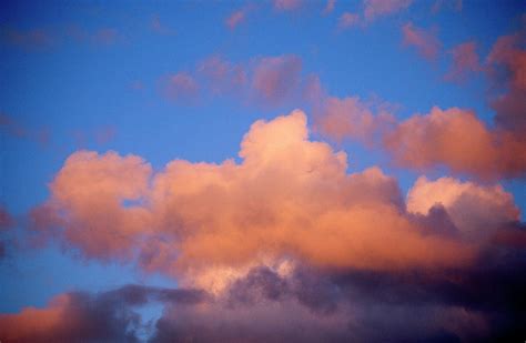 Cumulus Clouds In Sky At Sunset by Andrew Holt