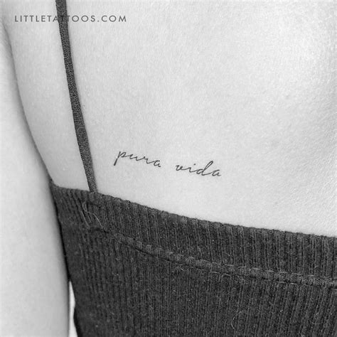 "Pura Vida" temporary tattoo located on the shoulder