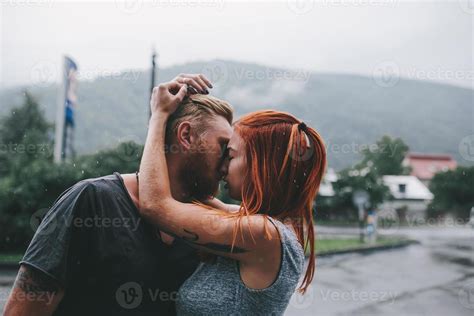 beautiful couple hugging in the rain 11781595 Stock Photo at Vecteezy