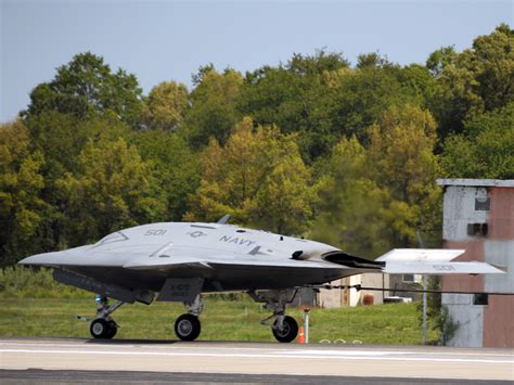 Navy's X-47B drone makes first carrier-style landing - NBC News