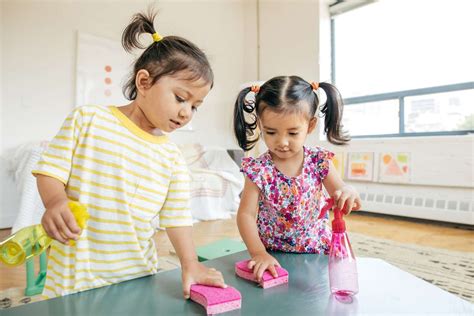 Children Cleaning Up Toys