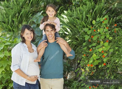 Family smiling together outdoors — Waist Up, Focus On Foreground ...