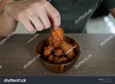 Man Eating Korean Spicy Chicken Wings Stock Photo 1417110131 | Shutterstock