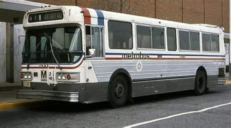 Retro Bus Parked in Front of Brick Building