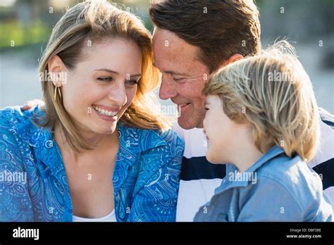 Family smiling together outdoors Stock Photo - Alamy