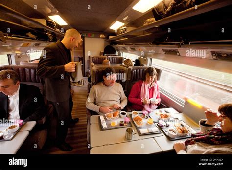 Eurostar train carriage, passengers being served food by the waiter on ...