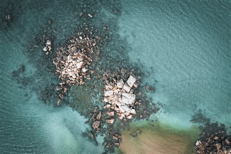 An Aerial Photography of a Rocky Shore on the Beach · Free Stock Photo