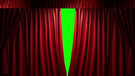 a green screen in front of a red curtain