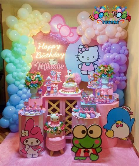 a hello kitty birthday party with balloons and decorations