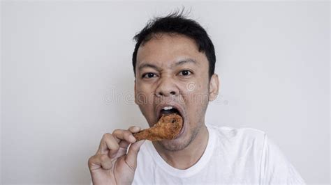 Young Asian Man is Eating Fried Chicken Wear White Shirt Stock Photo ...