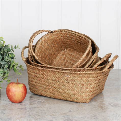 set of four oval wheat straw baskets by dibor | notonthehighstreet.com