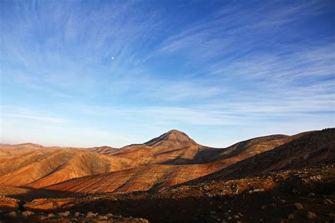 Blue Sky Under Brown Mountain · Free Stock Photo