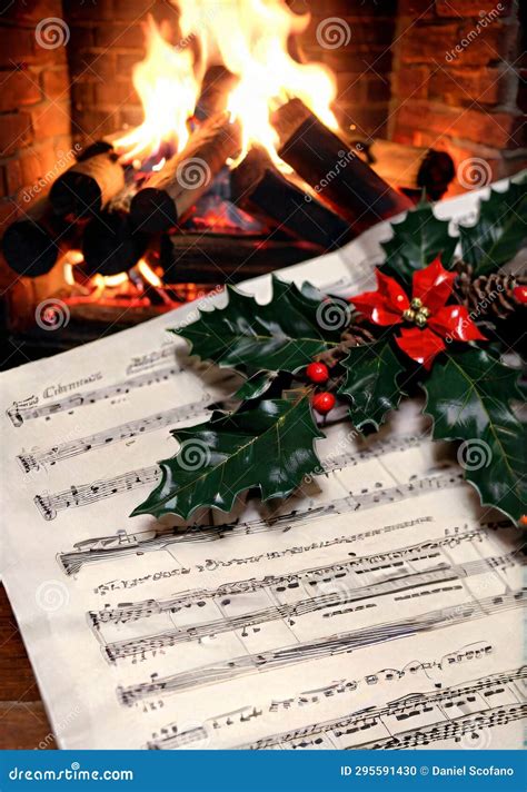 Christmas Carol Sheet Music, with a Fireplace in the Background ...